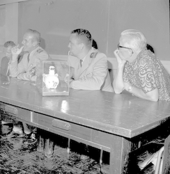 Paul Fye and Naval officers answer questions after the DSV Alvin salvage operation.