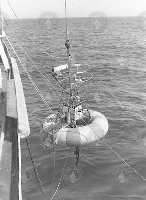 Donut buoy over side of ship.