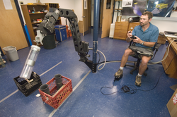 Matt Heintz testing HROV Nereus manipulator arm in lab.