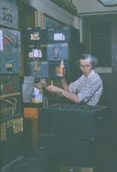 Dot Rogers holding drift bottle