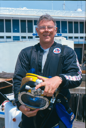 Sandy Williams with diving gear at the WHOI dock