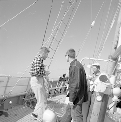 Frantz and Bercaw on deck of Aries, under sail.