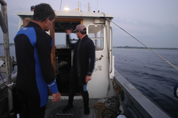 Jay Sisson (right) with Pat Lohman, preparing for dive to recover a tripod.