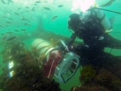 Diver installing new Imaging FlowCytobot at the base of MVCO ASIT.