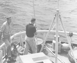 Cyril Backus, left, on fantail of Crawford