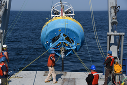 John Kemp (center) directing the deployment of an OOI surface buoy.