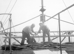 Davis Fahlquist (r) and unidentified man working on deck of Bear