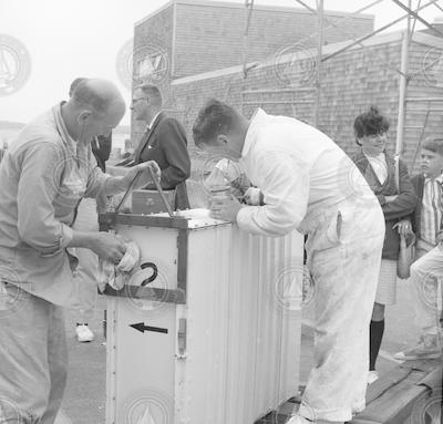 Group of people near equipment.