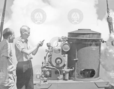 Al Woodcock and a colleague run a smoke generator.