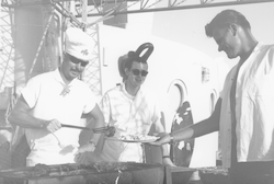 Calvin Karram and others cooking out on deck aboard Chain