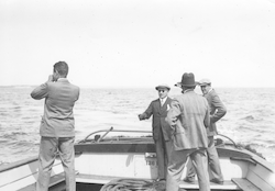 Men observing Atlantis sea trials