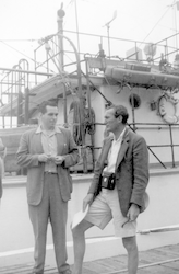 James Flanagan and Jan Hahn on dock with Bear behind