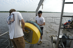 Malcolm Scully and Rocky Geyer move a mooring to a safe location.