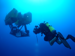 HROV Nereus with diver underwater.