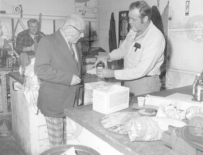 Carl Wing serving a drink to Stan Fisher