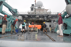 Preparing AUV Orpheus on deck of M/V Alucia for deployment operations.