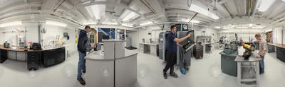 Panorama view of staff members working in the DunkWorks Center.