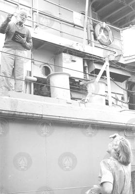 J. B. Hersey, aboard Chain, and Sally Hersey on dock