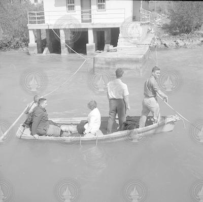 Unidentified people in small boat.