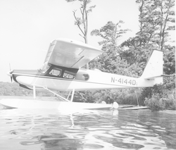 Helio courier on skid platform into the water