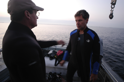 Jay Sisson with Pat Lohman, preparing for dive to recover a tripod.