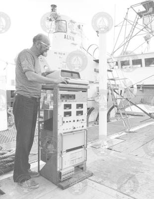 George Broderson working on deck of Lulu,  Alvin in background