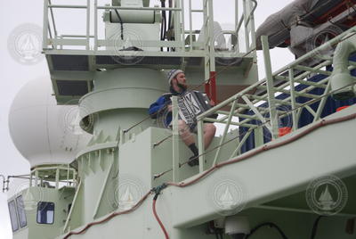 Knorr engineer Vasile Tudoran playing accordion on deck.