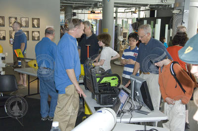 John Lund talking with visitors at the WHOI display.