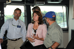 Peter Hill (left) and NSF associates touring R/V Sikuliaq's bridge.