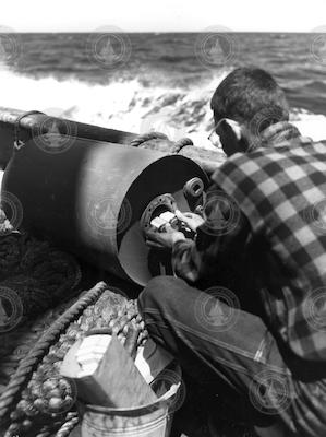 William Shultz loading primer into depth charges