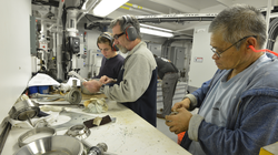 Jean Lavache, Wayne Sylvia and Roger Fong working in the Engine Room.