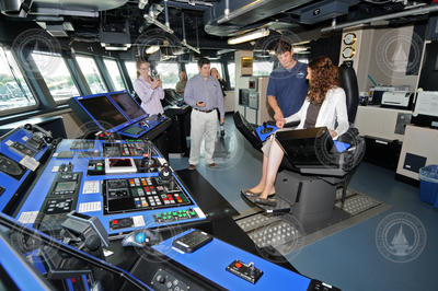 Captain Mike Hoshlyk showing NSF associates the bridge on R/V Sikuliaq.