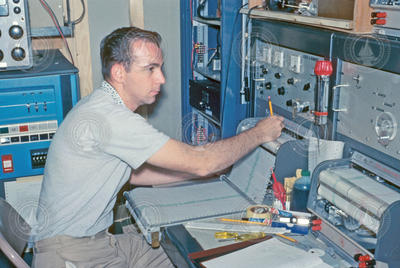 Carl Bowin working with first sea-going computer aboard R/V Chain.