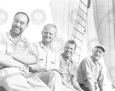Four men on deck of Blue Dolphin