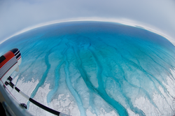 Helicopter view of meltwater channels on the ice.