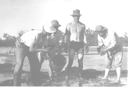 P. Bermudes, H. Rivero, D. Bumpus and H. Mandly in the mud