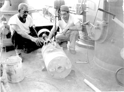 Alfred John (L) and Bill Halpin with equipment on deck of Chain