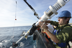 Larry George steadies the X-Spar buoy during deployment operations.