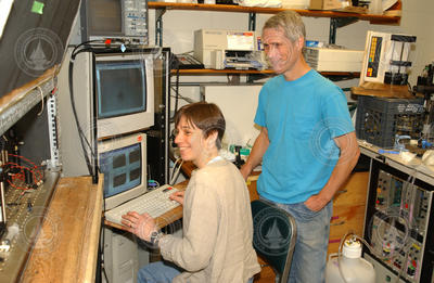 Heidi Sosik and Rob Olson working in the lab.