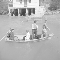 Unidentified people in small boat.