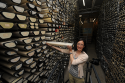 Phoebe Lam sorting through core sections in the Seafloor Samples Laboratory.