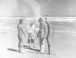 Ted Spencer, Al Woodcock, and Andrew Bunker working on the beach.