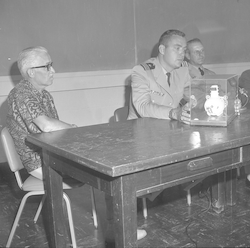 Paul Fye and Naval officers answer questions after the DSV Alvin salvage operation.