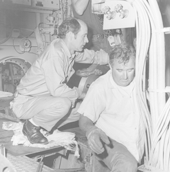 Bill Brown and Bobby Weeks working below deck of Knorr