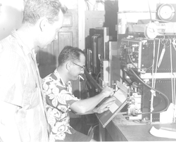 Two unidentified men working in lab aboard Crawford