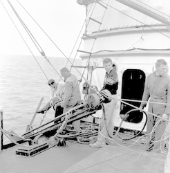 Group working on deck with hydraulic corer