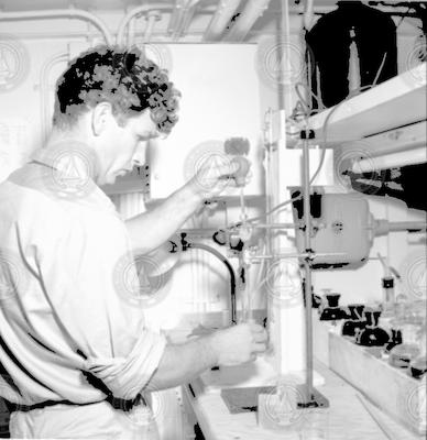 Eugene Krance working in lab aboard Albatross III