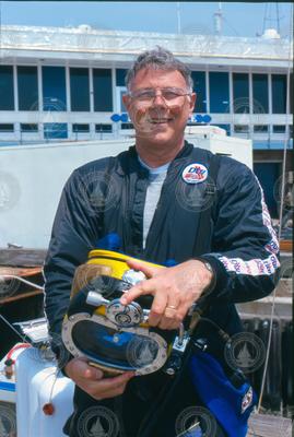 Sandy Williams with diving gear at the WHOI dock