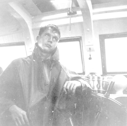 Dick Colburn in the wheelhouse on the Atlantis