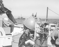 Peter Sachs with gear on deck of Atlantis II